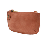 Our bestselling crossbody turn lock clutch has been re-imagined in soft, vegan suede leather in warm, autumnal hues.&nbsp;Sleek and versatile with removable straps, this style can be worn as a Crossbody, carried as a wristlet or a clutch, even doubles as a wallet! With interior credit card slots and enough space to carry your phone, sunglasses, and any other must-haves, all held securely by our locking closure. This casual style is destined to become your new go-to favorite all year long.
Product Details
Di