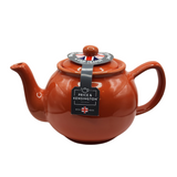 When it's time for a spot of tea, reach for one of our stoneware teapots, which can absorb the heat of boiling water without cracking. Likewise, the beautiful exterior is protected with a gloss to prevent the paint from warping or rippling. The classic bulbous shape allows tea leaves or bags to move freely for just the right amount of flavoring.&nbsp;

The burnt orange teapot is available in 2-cup or 6-cup size