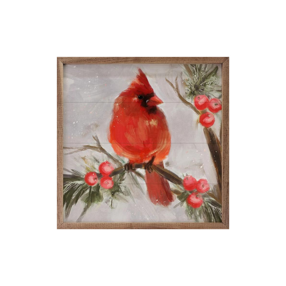 A beautiful cardinal sits on an evergreen branch with berries and looks off to the right.  This will be a stunning addition to your winter decor!