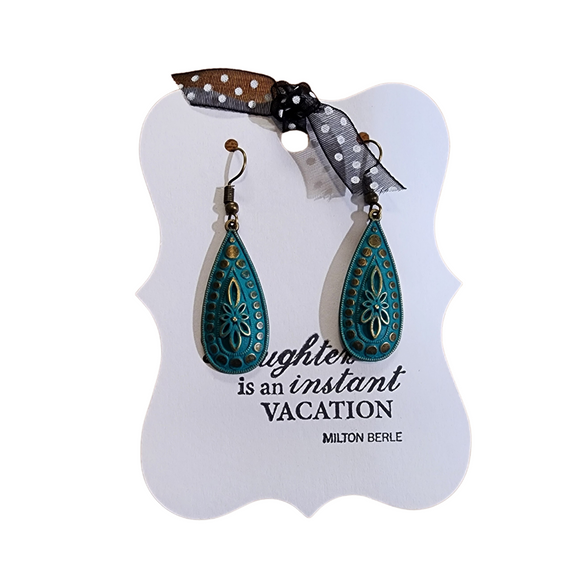 Wear these dramatic drops as a reminder to invest your time & talents wisely. Featuring a stylized flower surrounded by gradient circles and a beaded edge.

Measures 1 3/8