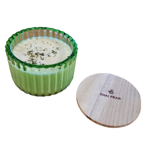 You'll love our new cathedral bowl candle style and size! This Thai pear candle has been poured into a pretty green-patterned glass and comes with a wooden lid.

Fresh and crisp, a pure pear fragrance with earthy notes on the back end.


Filled with 6.5 oz. of American Soybean WaxTM. Measures 4.25"W x 3.25 "H (with lid) with a 40+ hour burn time