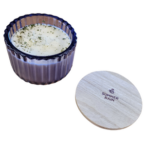 You'll love our new cathedral bowl candle style and size! This summer rain candle has been poured into a pretty purple-patterned glass and comes with a wooden lid.

Crisp morning dew, with a light earthy tone, this is a perfect summer fragrance!


Filled with 6.5 oz. of American Soybean WaxTM. Measures 4.25"W x 3.25 "H (with lid) with a 40+ hour burn time