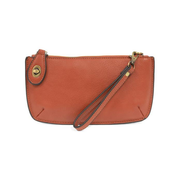Our most popular bag, this mini clutch, with its sleek silhouette, is as gorgeous as it is versatile.  Features include a polished turn lock, six card slots, and an interior zipper for change.  It can be styled in many ways, with removable straps to alternate between wallet, crossbody, and wristlet!   5
