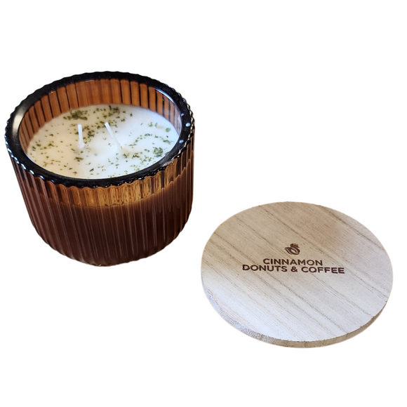 You'll love our new cathedral bowl candle style and size! This cinnamon donuts & coffee candle has been poured into a pretty brown-patterned glass and comes with a wooden lid.

A fragrant blend of warm cinnamon donuts and coffee notes.

Filled with 6.5 oz. of American Soybean WaxTM. Measures 4.25