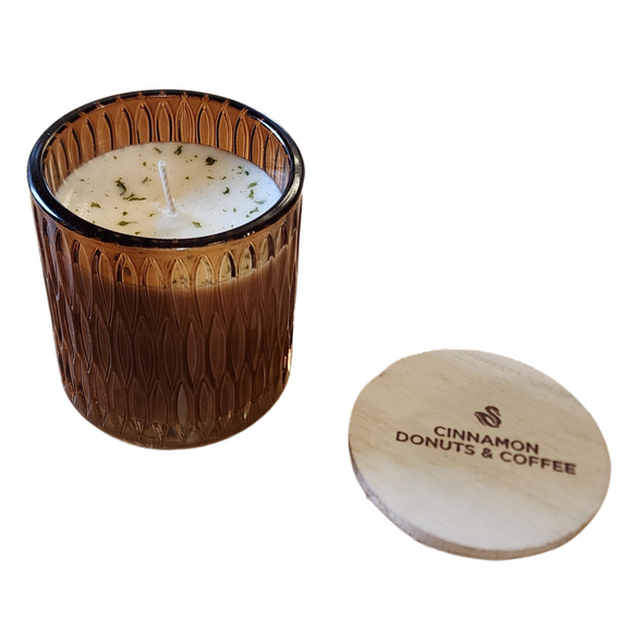 You'll love our newest cathedral glass tumbler! This cinnamon donuts & coffee scent has been poured into a pretty brown glass and comes with a wooden lid.

The scent of cinnamon donuts with coffee notes.

Filled with 6.5 oz. of American Soybean WaxTM. Measures 3.25