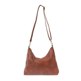 This oversized, slouchy, cool hobo bag is made of tumbled buffalo grain cinnamon-colored vegan leather, which gives it that casual boho chic look! With two included removable shoulder straps, you can wear it as a short shoulder bag or a crossbody bag.