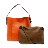 Equally timeless and modern, our best-selling classic hobo is made in rich vegan leather in a beautiful clementine orange color, accented with a brown strap.&nbsp; This roomy bag, accented with a large front pocket and a snap-in removable brown crossbody, has plenty of room to carry your needs in style.


MAIN BAG

12" h x 14" w x 6" d