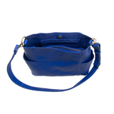 Casual and carefree crossbody in super soft pebble grain vegan leather! Our Kayleigh bucket bag in a stunning cobalt blue&nbsp;comes with a smaller bag that can be carried inside or used alone! The convenient side pockets of this bucket bag can carry your water bottle, phone or glasses.&nbsp;


11" W X 11.25" H X 3.5"
Magnetic Snap Closure
2 open and 1 zipper interior pockets
2 exterior open pockets and 1 back zipper pocket
12- 18" adjustable drop and detachable crossbody strap with lobster claw clasps
Brus