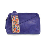 Retro styling crafted in antiqued vegan leather gives this cobalt clutch a vintage vibe. The removable woven wrist strap is the finishing touch on this stylish bag, so you can wear as a wristlet, a clutch, or even a crossbody with the included removable shoulder strap!





6.75"H x 9.75"W x 2.25"D

Removable and adjustable crossbody strap 22"-26"

Removable long wristlet strap 7.5" long

Zippered top closure

Interior zippered pocket

Exterior back zipper pocket

Brass plated hardware

100% vegan leather (