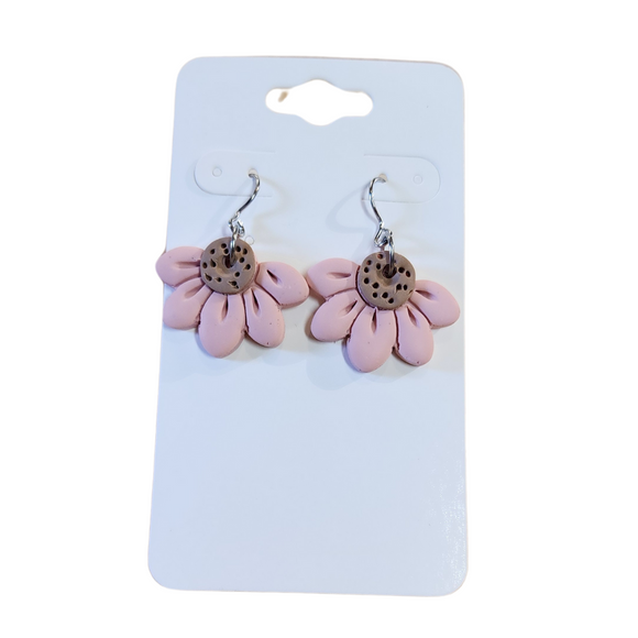 You will love these lightweight, trendy polymer clay daisy earrings that are the cutest! This one has five smooth petals in pink with earring hooks are comfortable and easy to wear and made of high-quality, strong/durable stainless steel, which is hypoallergenic and nickel-free. * 

This versatile earring design would accompany any outfit, from casual to dressed up! 

Handcrafted in Texas, USA 

CARE INSTRUCTIONS FOR EARRINGS * Store in a clean, dry place. * To clean: rub gently with a soft c