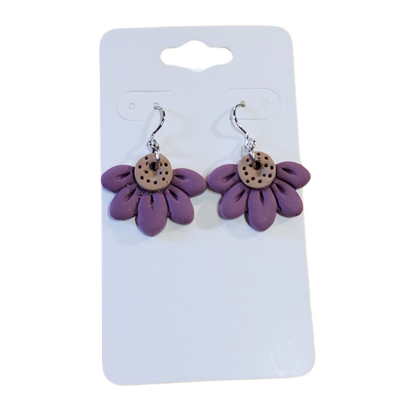 You will love these lightweight, trendy polymer clay daisy earrings that are the cutest! This one has five smooth petals in purple with earring hooks are comfortable and easy to wear and made of high-quality, strong/durable stainless steel, which is hypoallergenic and nickel-free. * 

This versatile earring design would accompany any outfit, from casual to dressed up! 

Handcrafted in Texas, USA 

CARE INSTRUCTIONS FOR EARRINGS * Store in a clean, dry place. * To clean: rub gently with a soft