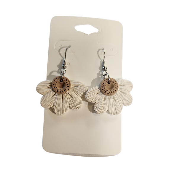 You will love these lightweight, trendy polymer clay daisy earrings that are the cutest! This one has five textured petals in cream with earring hooks are comfortable and easy to wear and made of high-quality, strong/durable stainless steel, which is hypoallergenic and nickel-free. * 

This versatile earring design would accompany any outfit, from casual to dressed up! 

Handcrafted in Texas, USA 

CARE INSTRUCTIONS FOR EARRINGS * Store in a clean, dry place. * To clean: rub gently with a sof
