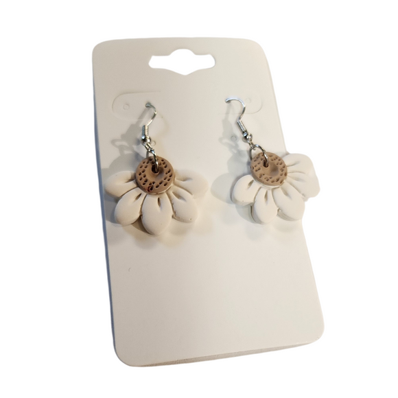 You will love these lightweight, trendy polymer clay daisy earrings that are the cutest! This one has five smooth petals in cream with earring hooks are comfortable and easy to wear and made of high-quality, strong/durable stainless steel, which is hypoallergenic and nickel-free. * 

This versatile earring design would accompany any outfit, from casual to dressed up! 

Handcrafted in Texas, USA 

CARE INSTRUCTIONS FOR EARRINGS * Store in a clean, dry place. * To clean: rub gently with a soft 