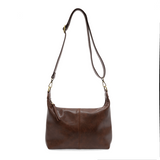 The Danna crossbody is masterfully crafted in our gorgeous new tumbled gloss vegan hickory leather to give your look a polished yet casual vibe. Fitted with a top zip closure accented by our signature logo zip pull and two removable and interchangeable shoulder straps; a short shoulder strap to wear snug to the body or a long adjustable, removable crossbody shoulder strap to wear as a crossbody, this slouchy hobo design is perfect for your everyday style.


Dimensions: 9.5 in. H X 10.5 in. W X 3.5 in. D
Top