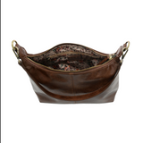 The Danna crossbody is masterfully crafted in our gorgeous new tumbled gloss vegan hickory leather to give your look a polished yet casual vibe. Fitted with a top zip closure accented by our signature logo zip pull and two removable and interchangeable shoulder straps; a short shoulder strap to wear snug to the body or a long adjustable, removable crossbody shoulder strap to wear as a crossbody, this slouchy hobo design is perfect for your everyday style.


Dimensions: 9.5 in. H X 10.5 in. W X 3.5 in. D
Top
