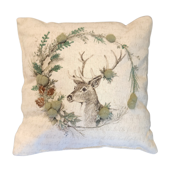 This beautiful mini pillow showcases a graceful deer at the heart of an embroidered wreath, beautifully accented with greyish green felt balls. Crafted from a soft muslin cream fabric adorned with whimsical writing, this pillow is a charming decor piece for your home!

8