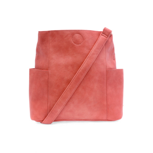 Casual and carefree crossbody in super soft pebble grain vegan leather! Our Kayleigh bucket bag in a beautiful desert coral color&nbsp;comes with a smaller bag that can be carried inside or used alone! The convenient side pockets of this bucket bag can carry your water bottle, phone or glasses.&nbsp;


11" W X 11.25" H X 3.5"
Magnetic Snap Closure
2 open and 1 zipper interior pockets
2 exterior open pockets and 1 back zipper pocket
12- 18" adjustable drop and detachable crossbody strap with lobster claw cla