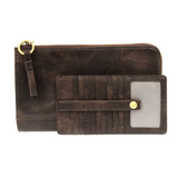 The Karina combines sleek styling with uber organization in beautiful antique-looking dark oak vegan leather! The ultimate in versatility, this bag can be worn as a crossbody, carried as a clutch, or as a wristlet.  The included bonus wallet with credit card slots, ID windows, zippered change pocket, and billfold will keep you organized on the go and can be carried separately! MAIN BAG: 9"H x 6"W x 1"D Removable and adjustable crossbody strap 21"-26" with lobster claw clasps