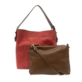 Equally timeless and modern, our best-selling classic hobo is made in rich vegan leather in a beautiful deep berry color, accented with a brown strap.  This roomy bag, accented with a large front pocket and a snap-in removable brown crossbody, has plenty of room to carry your needs in style.