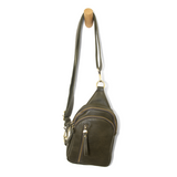 Blending uptown chic with downtown cool, the Skyler sling bag is made in rich vegan dark moss green leather! A convertible strap lends versatility, while a front zip pocket offers practical storage for your necessities. It is the perfect companion for a night out on the town or a fun day trip!  8" h x 5.5" w  x 2.25" d