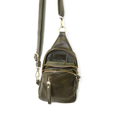 Blending uptown chic with downtown cool, the Skyler sling bag is made in rich vegan dark moss green leather! A convertible strap lends versatility, while a front zip pocket offers practical storage for your necessities. It is the perfect companion for a night out on the town or a fun day trip!  8" h x 5.5" w  x 2.25" d