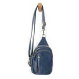 Blending uptown chic with downtown cool, the Skyler sling bag is made in beautiful sapphire blue velvet! A convertible strap lends versatility, while a front zip pocket offers practical storage for your necessities. It is the perfect companion for a night out on the town or a fun day trip!  8" h x 5.5" w  x 2.25" d