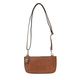 Our most popular bag, in a rich dark maple color, this mini clutch, with its sleek silhouette, is as gorgeous as it is versatile.  Features include a polished turn lock, six card slots, and an interior zipper for change.  It can be styled in many ways, with removable straps for alternating between wallet, crossbody, and wristlet!   5"H x 9.5"W x 1"D