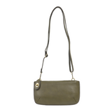 Our most popular bag, in a rich dark moss color, this mini clutch, with its sleek silhouette, is as gorgeous as it is versatile.  Features include a polished turn lock, six card slots, and an interior zipper for change.  It can be styled in many ways, with removable straps for alternating between wallet, crossbody, and wristlet!   5"H x 9.5"W x 1"D