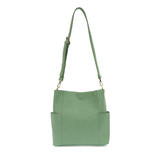 Casual and carefree crossbody in super soft pebble grain vegan leather! Our Kayleigh bucket bag is in a beautiful seafoam green color and comes with a smaller bag that can be carried inside or used alone! The convenient side pockets of this bucket bag can carry your water bottle, phone, or glasses.&nbsp;