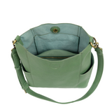 Casual and carefree crossbody in super soft pebble grain vegan leather! Our Kayleigh bucket bag is in a beautiful seafoam green color and comes with a smaller bag that can be carried inside or used alone! The convenient side pockets of this bucket bag can carry your water bottle, phone, or glasses.&nbsp;