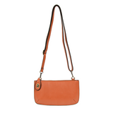Our most popular bag, in a beautiful mango color, this mini clutch, with its sleek silhouette, is as gorgeous as it is versatile.&nbsp; Features include a polished turn lock, six card slots, and an interior zipper for change.&nbsp; It can be styled in many ways, with removable straps for alternating between wallet, crossbody, and wristlet!  &nbsp;5"H x 9.5"W x 1"D