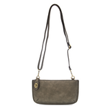Our most popular bag, in metallic dark chrome color, this mini clutch, with its sleek silhouette, is as gorgeous as it is versatile.  Features include a polished turn lock, six card slots, and an interior zipper for change.  It can be styled in many ways, with removable straps for alternating between wallet, crossbody, and wristlet!   5"H x 9.5"W x 1"D  Removable and adjustable crossbody strap 13"-24"  Wristlet strap 7" long  interior zippered pocket  brass plated hardware  100% vegan leather (polyurethane)