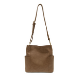 Casual and carefree crossbody in super soft pebble grain vegan leather! Our Kayleigh bucket bag in a beautiful fawn, tan color comes with a smaller bag that can be carried inside or used alone! The convenient side pockets of this bucket bag can carry your water bottle, phone, or glasses.  11" W X 11.25" H X 3.5"