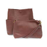 Casual and carefree crossbody in super soft pebble grain vegan leather! Our Kayleigh bucket bag in a beautiful plum color comes with a smaller bag that can be carried inside or used alone! The convenient side pockets of this bucket bag can carry your water bottle, phone, or glasses.  11" W X 11.25" H X 3.5"