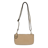 Our most popular bag, in a beautiful beach wood color, this mini clutch, with its sleek silhouette, is as gorgeous as it is versatile.  Features include a polished turn lock, six card slots, and an interior zipper for change.  It can be styled in many ways, with removable straps for alternating between wallet, crossbody, and wristlet!   5"H x 9.5"W x 1"D
