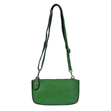 Our most popular bag in beautiful bright clover green! With its sleek silhouette, this mini clutch is as gorgeous as it is versatile.  Features include a polished turn lock, six card slots, and an interior zipper for change.  It can be styled in many ways, with removable straps for alternating between wallet, crossbody, and wristlet!   5"H x 9.5"W x 1"D