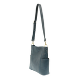 Casual and carefree crossbody in super soft pebble grain vegan leather! Our Kayleigh bucket bag in a beautiful dark cyan comes with a smaller bag that can be carried inside or used alone! The convenient side pockets of this bucket bag can carry your water bottle, phone, or glasses.  11" W X 11.25" H X 3.5"