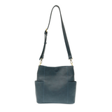 Casual and carefree crossbody in super soft pebble grain vegan leather! Our Kayleigh bucket bag in a beautiful dark cyan comes with a smaller bag that can be carried inside or used alone! The convenient side pockets of this bucket bag can carry your water bottle, phone, or glasses.  11" W X 11.25" H X 3.5"