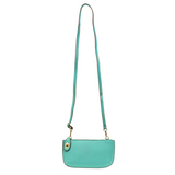 Our most popular bag, in a vibrant Mayan Green! With its sleek silhouette, this mini clutch is as gorgeous as it is versatile.  Features include a polished turn lock, six card slots, and an interior zipper for change.  It can be styled in many ways, with removable straps for alternating between wallet, crossbody, and wristlet!   5"H x 9.5"W x 1"D  Removable and adjustable crossbody strap 13"-24"  Wristlet strap 7" long