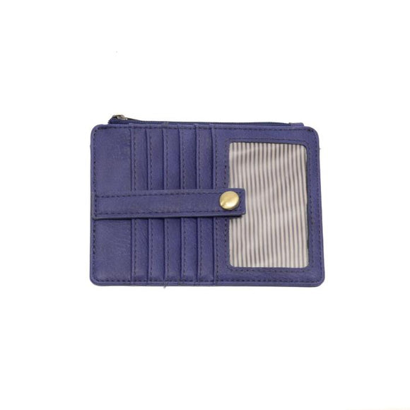 We love this mini wallet in a dusk blue colored vegan leather! It is full of style and will hold your license and up to six credit cards. The zipper pocket is roomy enough for your change and cash, and a pocket is on the back.  This mini wallet is perfect for you, but it makes an awesome gift!

DIMENSIONS: 4 IN. H X 5.5 IN. W X .25 IN. D

ZIPPERED TOP CLOSURE ON EDGE

6 CREDIT CARD POCKETS

ID WINDOW POCKET

EXTERIOR PASSPORT POCKET

STRIPED LINING

BRASS PLATED HARDWARE

100% VEGAN LEATHER (POLYURETHA