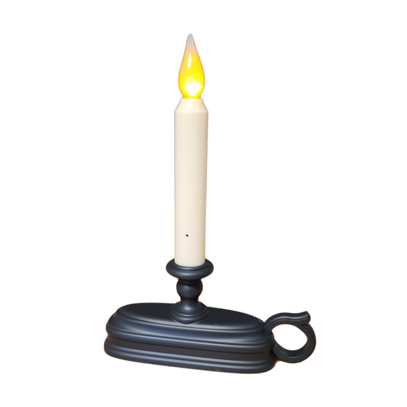 Oh, how we love this candle!  Put it in a window, or use it in your displays!  It will automatically turn on at dusk and off at dawn.  It has a realistic flickering flame that changes from white to amber by just tilting the candle upside down and back again! How cool is that?

To use, remove the bottom cover by pushing down on the tab and lifting up the cover.  Insert 2 C alkaline batteries (not included). Slide the cover back into position and snap into place.  Place the candle at 
