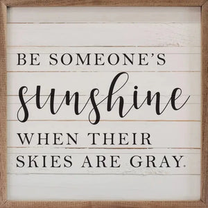 We love this sign! It has the words "Be Someone's Sunshine When Their Skies Are Gray" in print & cursive font on top of whitewashed wood background.  It's a reminder to be a bright spot in someone's day!  It is made from high-quality American hardwood planks with a hand-painted face, printed with UV-cured ink, and framed in a natural walnut frame. Each piece is unique with its own personality, marks, wood grain, and look. Easy to clean with a dry cloth.  Made in the USA  4" x 4" x 1"
