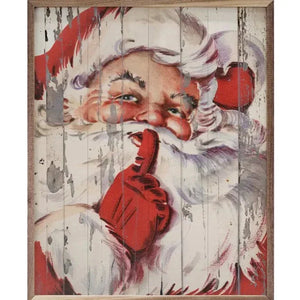 This Santa is by far our favorite! The picture is distressed to look old, and he is in his traditional red outfit he's got a slight grin on his face while he has a finger up to his mouth to say "shhhh!"  Bring a bit of nostalgia to your decor this year with this artwork!  It is made from high-quality American hardwood planks with a hand-painted face, printed with UV cured ink, and is framed in a natural walnut frame.   8" w x 10" h 