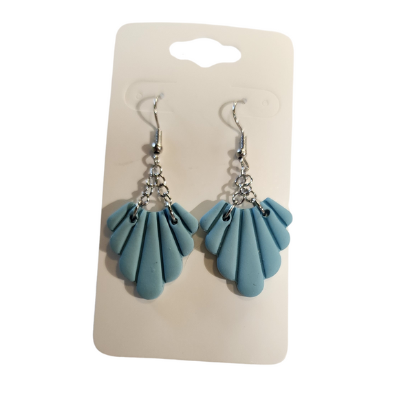 You will love these lightweight, trendy polymer earrings with it's beautiful light blue color and sweet frill like design hanging from silver chains for a fun dangle on your ears! The earring hooks are comfortable and easy to wear and coated with a resin layer to give them a pretty shine and finished look. The hooks are made of high-quality, strong/durable stainless steel, which is hypoallergenic and nickel-free. * 

This versatile earring design would accompany any outfit, from casual to dressed up!&n