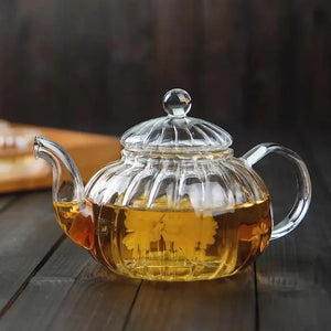 Make your freshly brewed tea using this convenient Glass Teapot with Infuser! Made with high-quality, lead-free borosilicate glass, this teapot is strong, sturdy, and high-temperature resistant.  The Glass Teapot with Infuser is also the perfect size (20 oz) for sharing or enjoying a cup yourself!   8" W x 5.5" d x 5" H