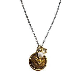 This small coin pendant was hand casted using a real English farthing coin. It is reversible with a bird on one side and a headshot on the other. The coin is accented with a crystal charm. the gold coin is paired with a non tarnishing stainless steel chain.&nbsp;

18””