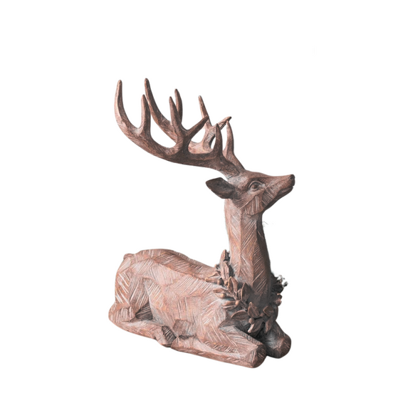 This exquisite faux wood sitting deer gazes up to the right, adorned with a beautifully intricate wreath around its neck. The stunning etchings on the deer elevate its charm—envision how captivating it would be as a striking centerpiece in your home!

11.75