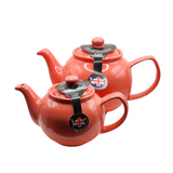 When it's time for a spot of tea, reach for one of our stoneware teapots, which can absorb the heat of boiling water without cracking. Likewise, the beautiful exterior is protected with a gloss to prevent the paint from warping or rippling. The classic bulbous shape allows tea leaves or bags to move freely for just the right amount of flavoring.&nbsp;

Flamingo colored&nbsp;teapot is available in 2-cup or 6-cup size