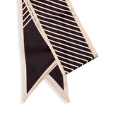Make a statement with this tan and black striped scarf!

Approximately 57" L x 5.25" W

100% Polyester