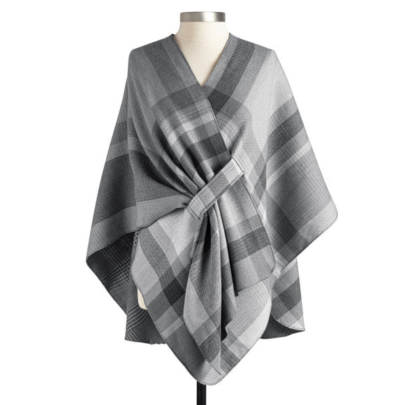 This beautiful wrap will be a staple in your closet this year! It can hang loosely, but we love the option of tucking in one front end into the loop attached to this wrap that does double duty because it reverses to a smaller charcoal plaid on the other side - woohoo! Two wraps in ONE to stretch out your wardrobe, giving so many options!  100% Polyester  One size fits most. Laid flat measurements are approximately  44